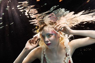 Glamorous Caucasian woman under water
