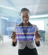 African American businesswoman using digital display