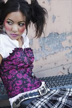 Young Asian woman wearing funky clothing