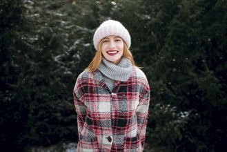 Caucasian woman smiling near trees