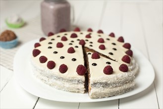 Cake decorated with raspberries