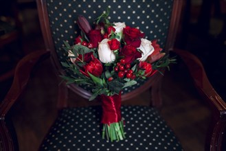Bouquet of flowers on armchair