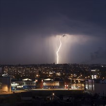 Lightning strike in city at night