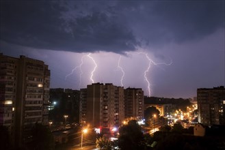 Lightning over city at night