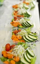 Sliced vegetables in plastic containers