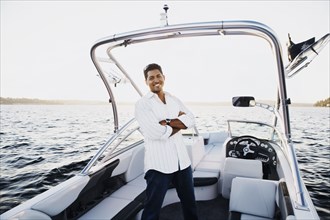 Young man smiling in a boat