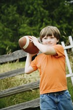 Boy throwing football