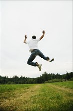 Man jumping in field