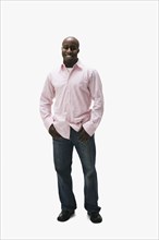 Portrait of African man with thumbs in pockets