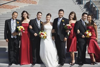 Multi-ethnic bridal party outdoors