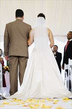 Bride being walked down aisle