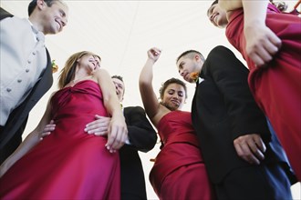 Low angle view of multi-ethnic bridal party