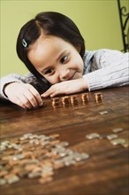 Asian girl counting coins