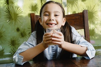 Asian girl drinking milk