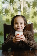 Asian girl drinking milk