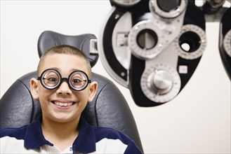 Asian boy in eye doctor's office