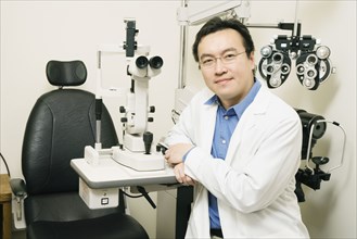 Asian male optometrist in office