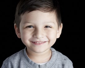 Close up of Hispanic boy smiling