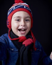 Close up of Hispanic boy wearing warm clothing