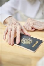 Older Caucasian woman holding Mexico passport