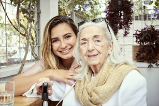 Portrait of smiling grandmother and granddaughter
