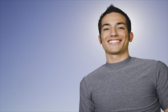 Confident Hispanic man smiling