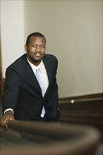 African businessman ascending staircase