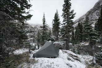 Camping tent in snowy landscape