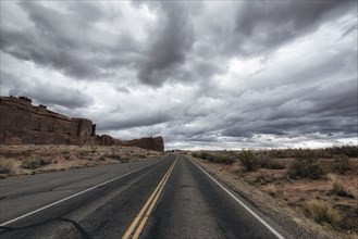 Street in desert under clouds