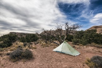 Clouds over tent in desert
