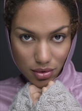 Mixed Race woman wearing hooded shirt