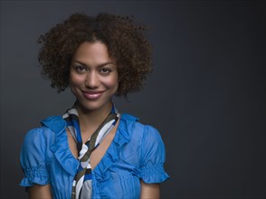 Mixed Race woman wearing scarf around neck