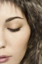 Close up of Mixed Race woman with eyes closed