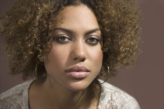 Mixed Race woman with curly hair