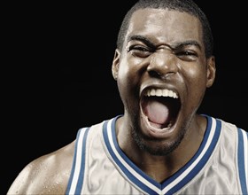African basketball player shouting