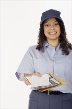 Studio shot of Hispanic female postal worker