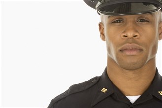 Studio shot of African male police officer