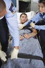 Man in ambulance with paramedics