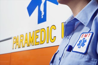 Close up of paramedic next to ambulance