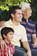 Hispanic grandfather with son and grandson