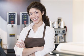 Mixed Race woman working at cafe