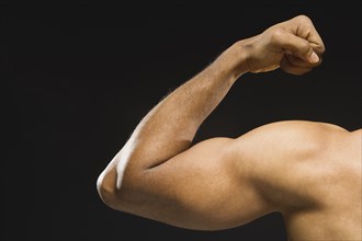 African American man flexing biceps