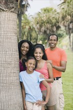 African family next to tree