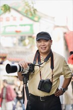 Chinese photographer on urban street