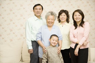 Chinese multi-generational family smiling