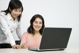 Chinese businesswomen working together