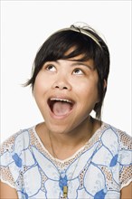 Asian woman looking up with mouth open