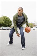 African American man playing basketball