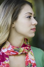 Hispanic woman in colorful scarf