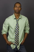 Serious African American man wearing shirt and tie